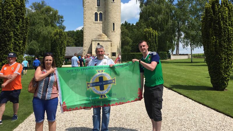 Northern Ireland football fans at the Ulster Tower in Somme, France, as they made a pilgrimage to a First World War battle site where thousands of their countrymen died a century ago. Picture by Michael McHugh, Press Association