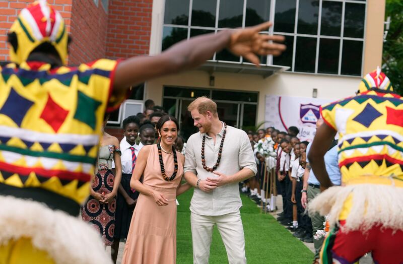 Harry and Meghan at the Lights Academy in Abuja, Nigeria (Sunday Alamba/AP)