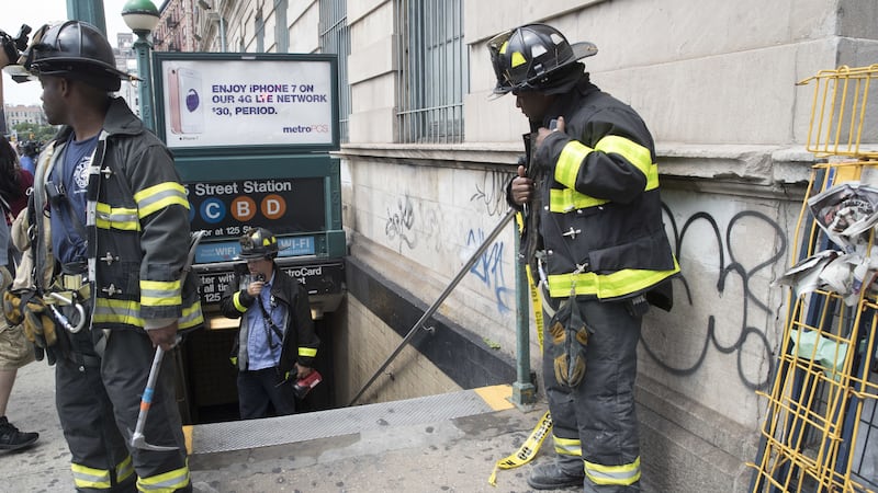 Passengers were led out of a subway tunnel to safety.