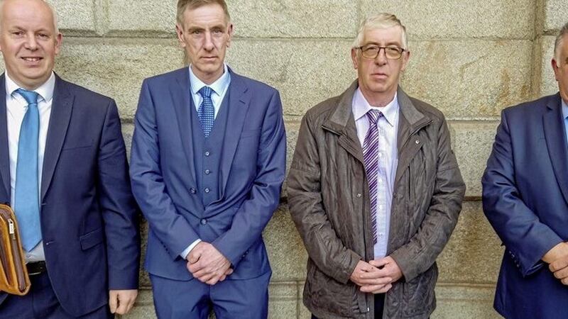 (From left) Ulster Human Rights Watch liaison officer Jonathan Larner with Lester Elliott, Jim Elliott and Cyrill Elliott, whose father was murdered in 1972, pictured at Dublin&#39;s Four Courts. 