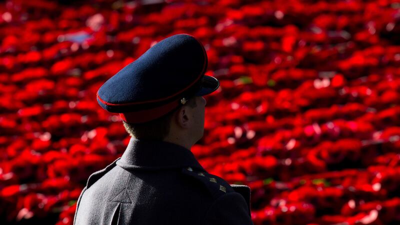 A British soldier looks out over poppy wreaths laid at the Cenotaph memorial during the annual Remembrance Sunday Service in Whitehall in  London, held in tribute for members of the armed forces who have died in major conflicts. Picture by Dominic Lipinski, Press Association&nbsp;