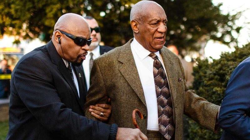 Bill Cosby enters the Montgomery County Courthouse during an earlier hearing