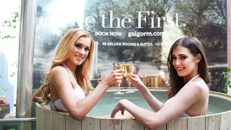 Models Aimee Boyle, winner of Sunday Life Cover Girl competition 2015, and Rebecca Maguire, Miss Ireland 2012, toast the new outdoor spa in Belfast city centre 
