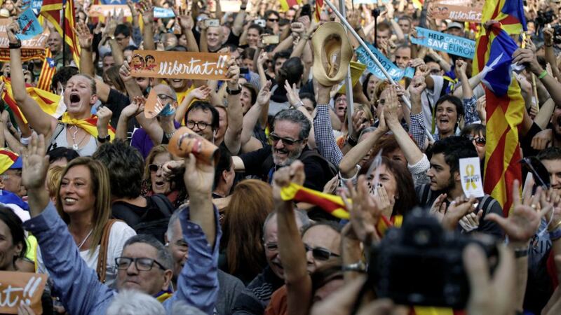 Protesters shouts slogans during a rally outside the Catalan Parliament, in Barcelona PICTURE: Emilio Morenatti/AP 