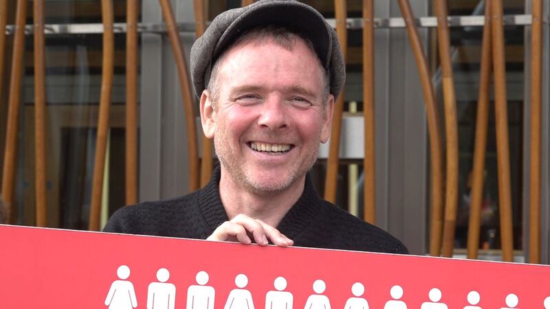 Stuart Murdoch attended a protest outside the Scottish Parliament calling for specialist treatment for the illness.