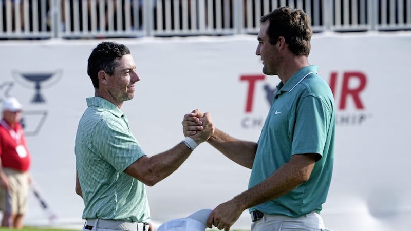 Rory McIlroy (left) and Scottie Scheffler after their round on the 18th green during the final round of the Tour Championship golf tournament at East Lake Golf Club in Atlanta Picture: Steve Helber/AP 