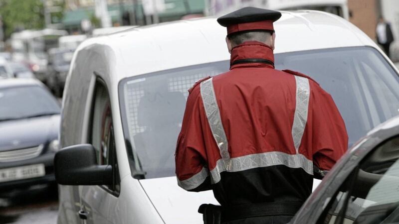 Plans to remove dozens of towns from routine parking warden patrols have not yet been implemented 
