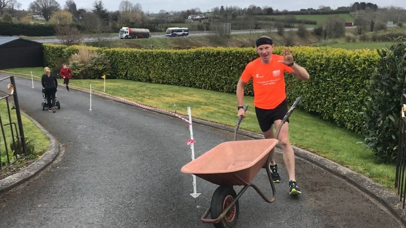 Keith Clarke ran a full marathon in his driveway while pushing a wheelbarrow, to raise money for the NHS.&nbsp;Picture by Press Association