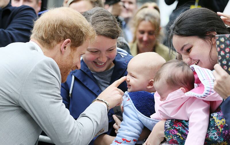 Prince Harry meets Emma Mason (second left) and her seven month old son Henry Mason in St Anne's Square, Belfast&nbsp;