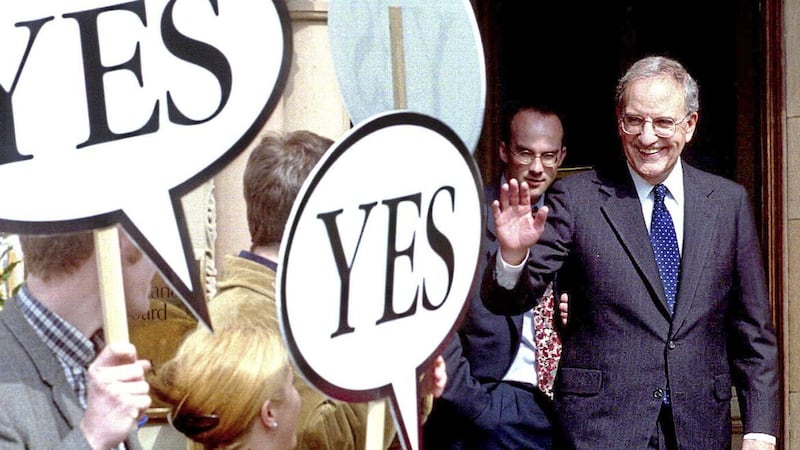 Senator George Mitchell waves to referendum &quot;Yes&quot; campaign supporters at the Culloden Hotel near Belfast following the signing of the Good Friday Agreement in 1998 