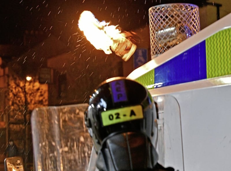 A petrol bomb thrown at police lines in Sandy Row in south Belfast on Friday. Picture by Alan Lewis, Photopress 