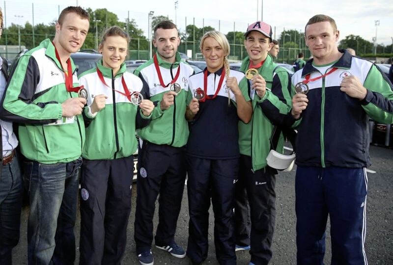 Alanna Nihell (third from right) poses with her 2014 Commonwealth Games bronze medal alongside team-mates Steven Donnelly, Michaela Walsh, Sean Duffy, Michael Conlan and Sean McGlinchey. Picture by PA 