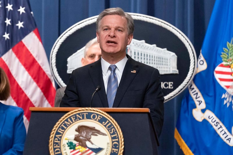 FBI director Christopher Wray speaks during a news conference to announce an international ransomware enforcement action, at the Department of Justice in Washington