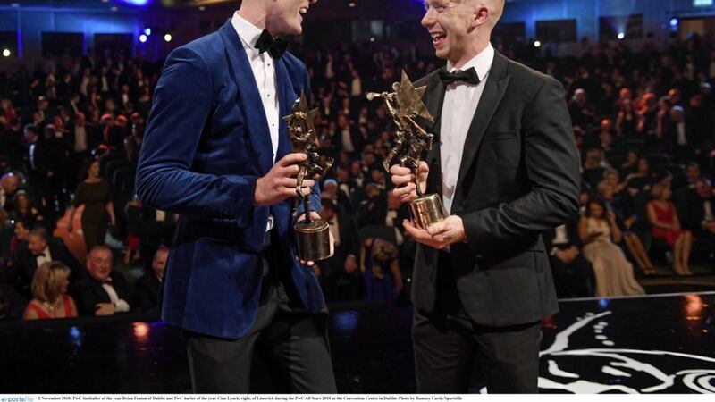 PwC Footballer of the Year Brian Fenton of Dublin and Hurler of the Year Cian Lynch (right) of Limerick during the 2018 PwC All Stars gala awards evening at the Convention Centre in Dublin. Picture by Ramsey Cardy/Sportsfile. 