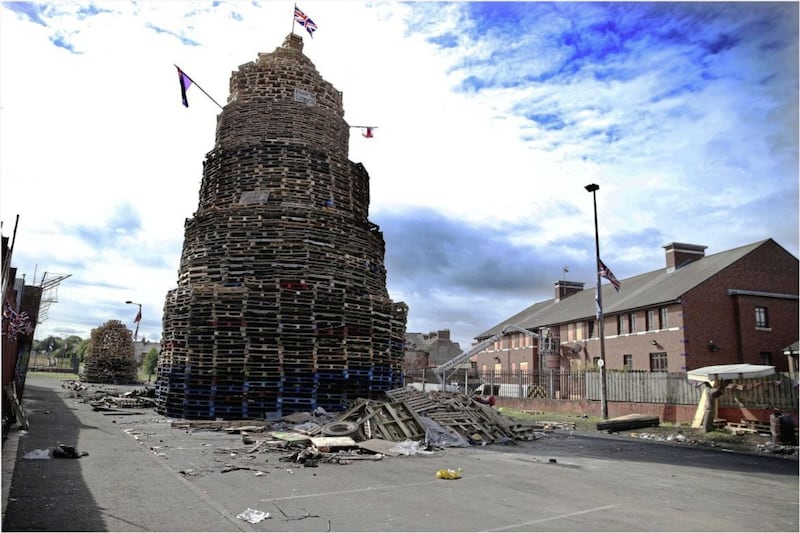 Contractors boarded up the windows of homes close to a contentious bonfire in Ravenscroft Avenue/Bloomfield Walkway bonfire in east Belfast. Picture by Hugh Russell