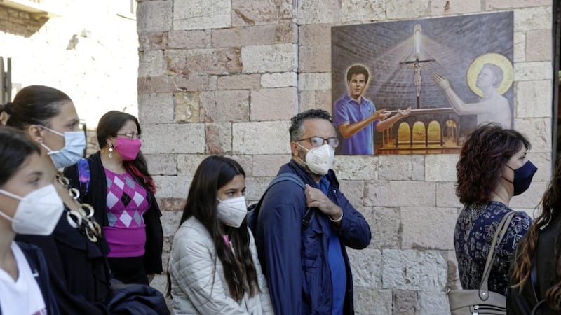 People arrive at Assisi on Saturday for the beatification of 15-year-old Carlo Acutis. Picture by AP Photo/Gregorio Borgia 