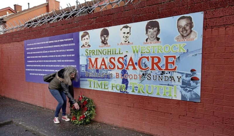Wreaths are laid at a mural for the Springhill-Westrock Massacre. Picture by Ann McManus 