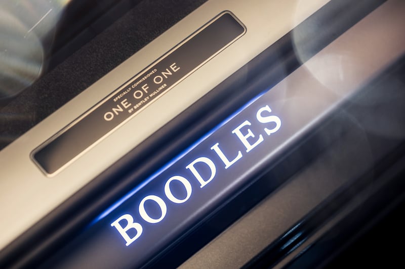There are illuminated Boodles scuff plates and even welcome lights in the door mirrors that feature the logo, too. (Credit: Bentley media)