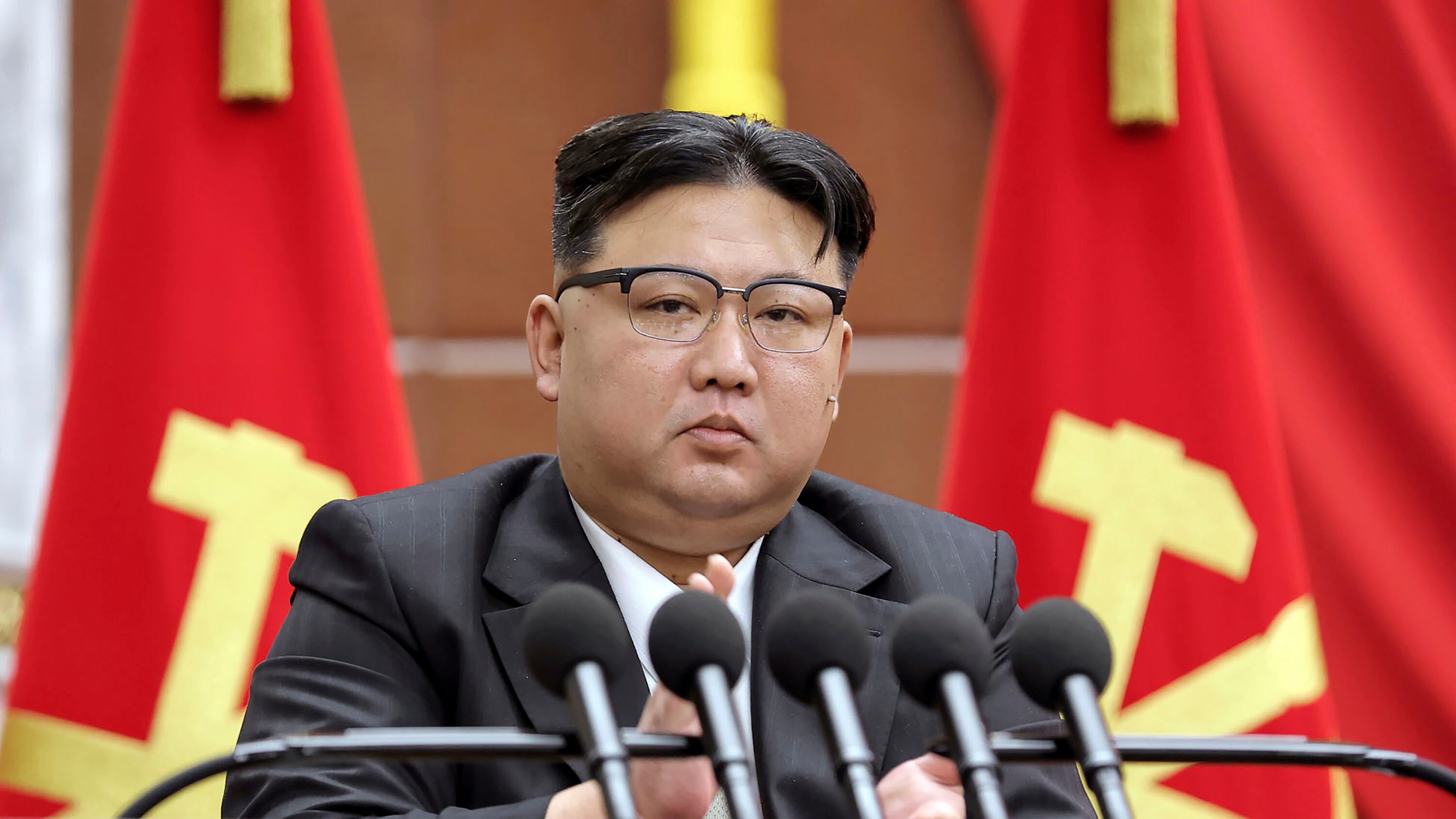 North Korean leader Kim Jong Un has vowed to launch three additional military spy satellites, produce more nuclear materials and introduce modern attack drones in 2024 (Korean Central News Agency/Korea News Service/AP)