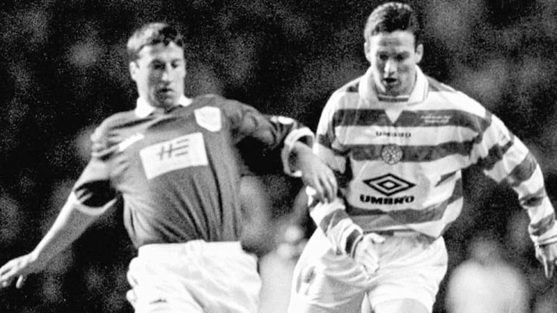 Celtic&rsquo;s Paul Lambert moves in to tackle St Johnstone&rsquo;s Nathan Lowdes during a Scottish Premier game at Celtic Park, Glasgow