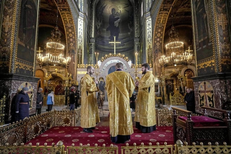 Ukrainian Orthodox Church clerics conduct a religious service at the St Volodymyr&#39;s Cathedral in Kyiv last Sunday, as Russia&#39;s invasion intensifies. Picture by AP Photo/Vadim Ghirda. 