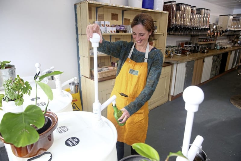 Alice Wilkinson fills a container with washing liquid at the Refill Quarter shop on the Belmont Road in east Belfast. Picture Mal McCann 