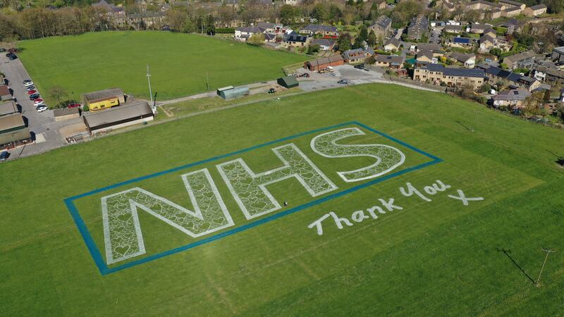 The 100m-wide NHS logo, filled with hearts and signed off with a ‘thank you’, has been created in Mytholmroyd,  West Yorkshire.