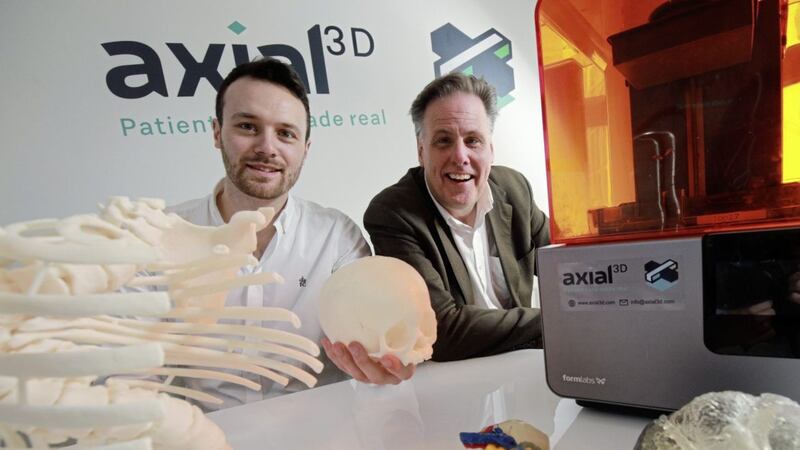 Daniel Crawford , CEO of axial3D and John Murray, investment director of Techstart Ventures are pictured with examples of the 3D medical images, which are advancing surgery worldwide. 