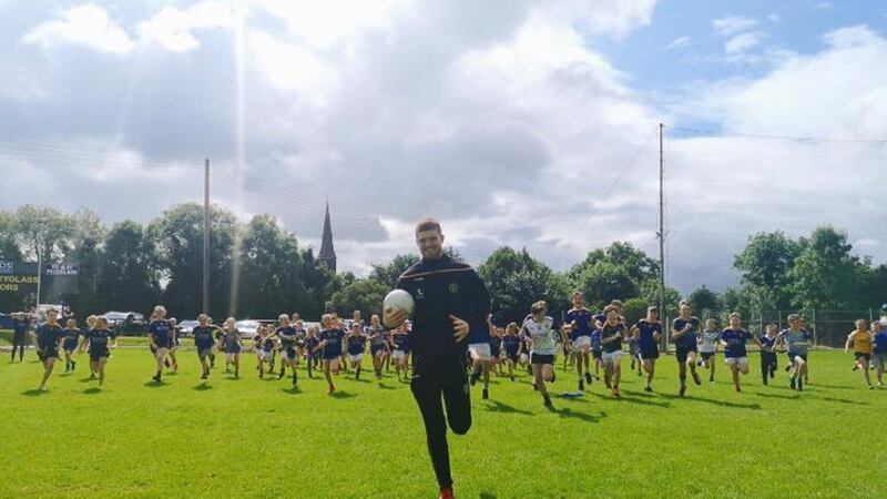Tyrone attacker Cathal McShane took time out of his All-Ireland semi-final preparations against Kerry on Sunday to talk to over 100 children at St Ergnat's Moneyglass GAC Summer Camp from ages 4-14. The hugely successful Moneyglass Summer Camp broke records this year with 115 kids taking part.&nbsp;