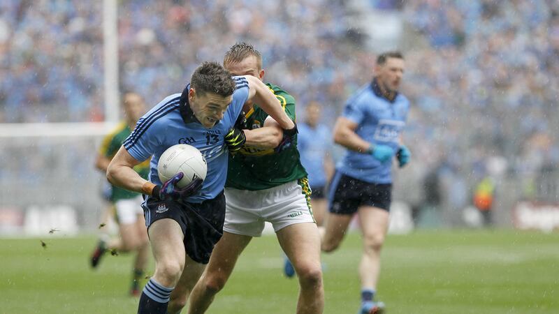 Dublin's Paddy Andrews drives away from Kerry's Fionn Fitzgerald and Anthony Maher during Sunday's All-Ireland Senior Championship final at Croke Park<br/>Picture: Colm O'Reilly