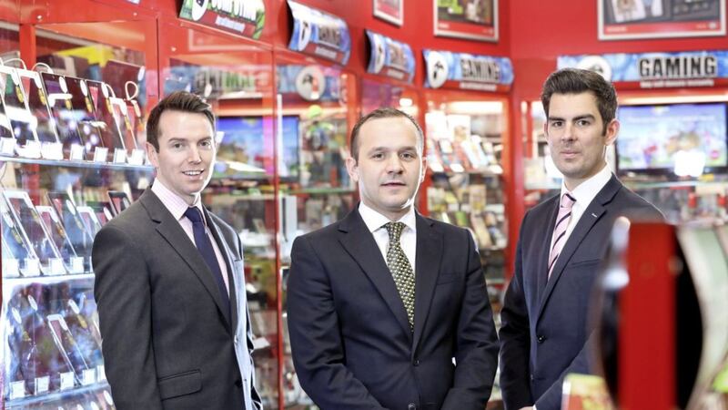 Pictured in Cookstown&rsquo;s new CeX store are Lambert Smith Hampton&rsquo;s retail team Tony Kernan, Gary Martin and Ryan Kee. The store is one of three new offerings on Cookstown&#39;s main street 