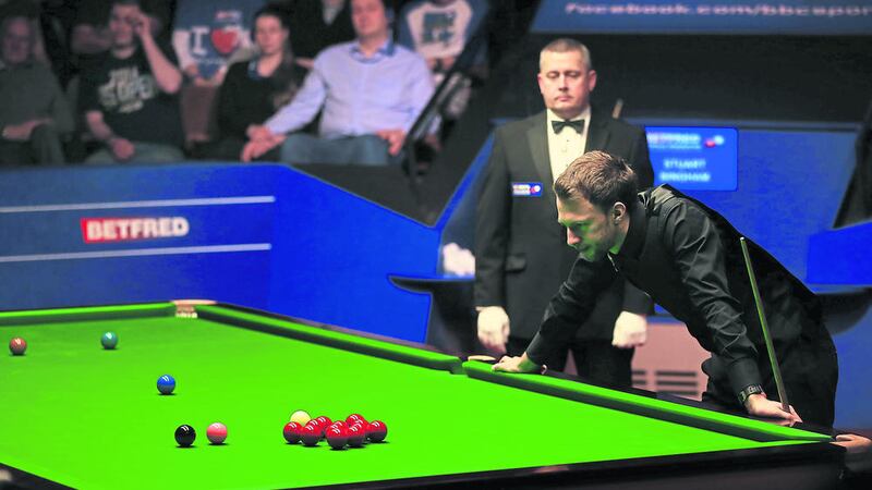 England&#39;s Judd Trump looks hard at the red set of balls on the table during his semi final match against England&#39;s Stuart Bingham during day thirteen of the Betfred World Championships at the Crucible Theatre, Sheffield 