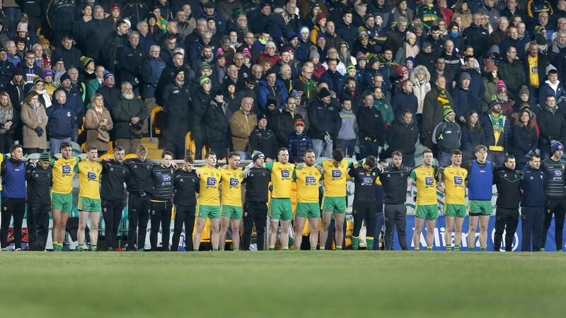 The Donegal squad lines up in front of the MacCumhaill Park crowd for a moment's silence in memory of the four young men who died in a car accident last weekend. Picture by Margaret McLaughlin