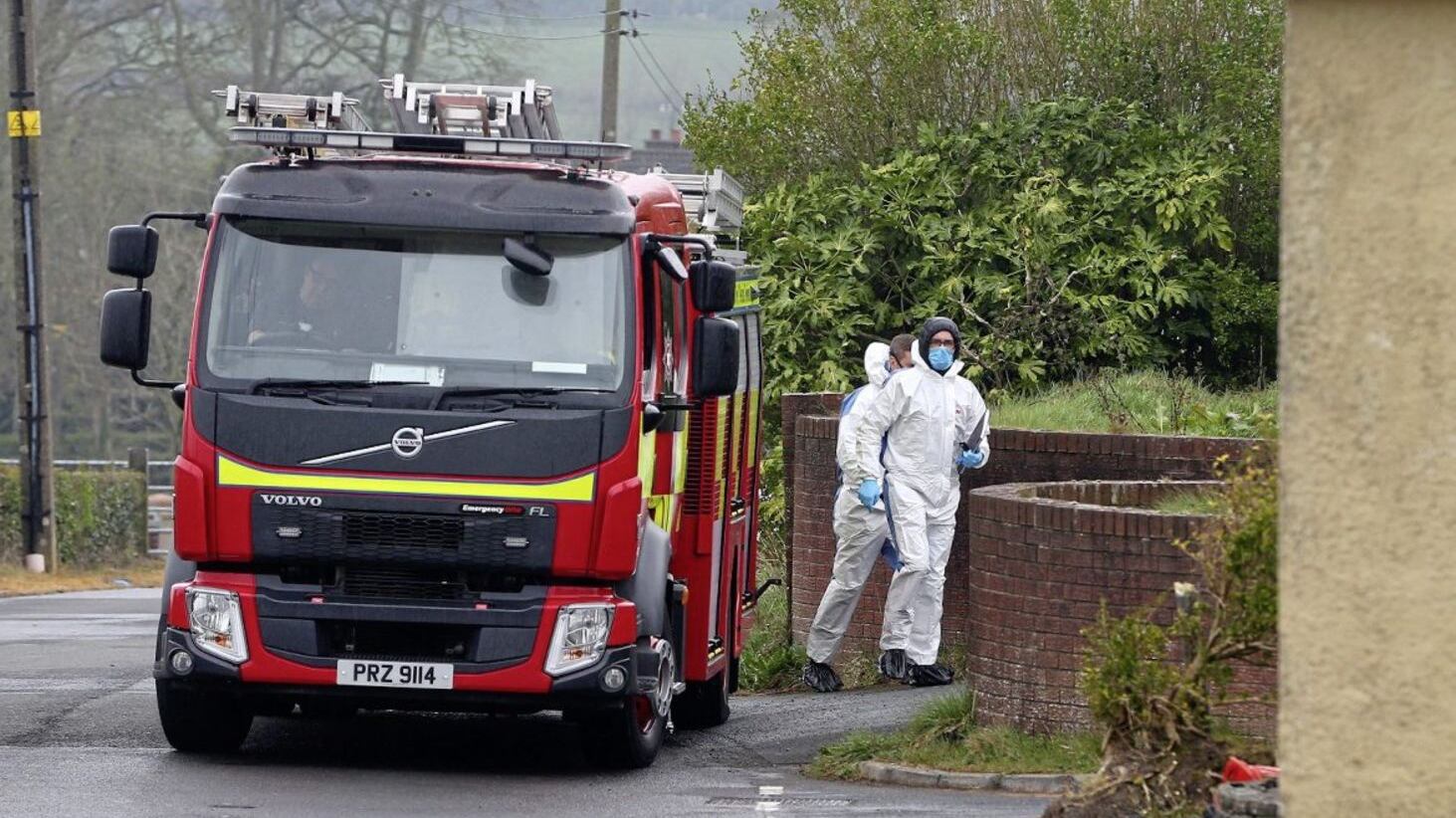 Police and firefighters at the scene of a fatal house fire in Carryduff yesterday. Picture by Mal McCann 