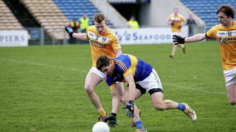 Peter Healy, on his League debut for Antrim, closes down Tipperary&#39;s Philip Austin. Pic Seamus Loughran 