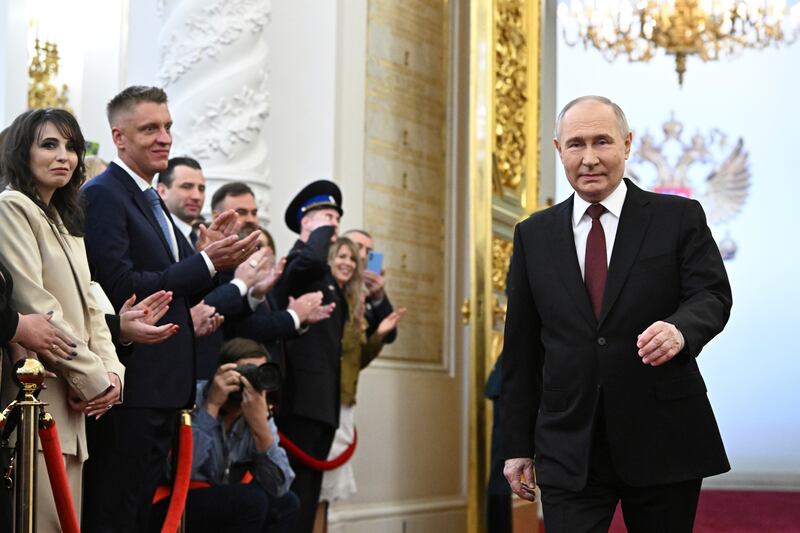 Vladimir Putin arrives for the ceremony (Sergei Bobylev/AP)