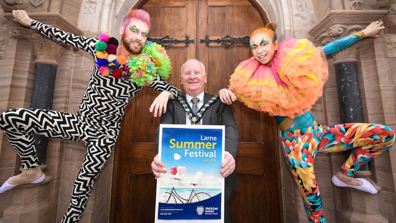 Billy Ashe, mayor of Mid and East Antrim Borough Council, with performers outside town hall at the launch of the Larne festival 