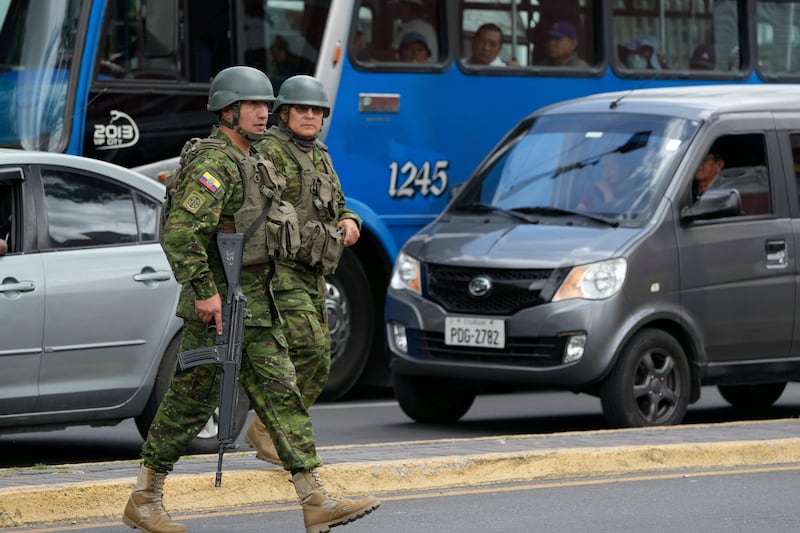 Soldiers patrol in the Carapungo neighbourhood of Quito, Ecuador (Dolores Ochoa/AP)