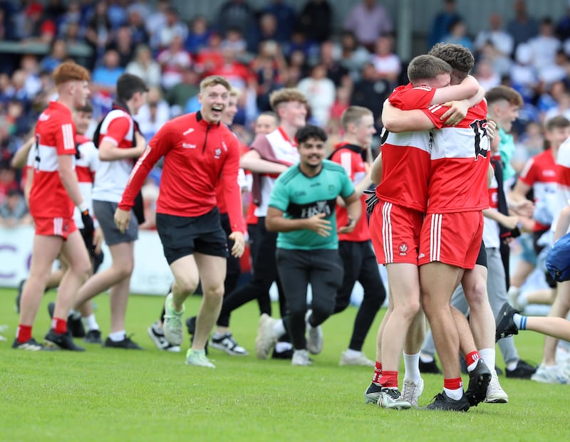 Derry Minors' Eamon Young and Oisin Doherty embrace at the final whistle. Picture: Philip Walsh