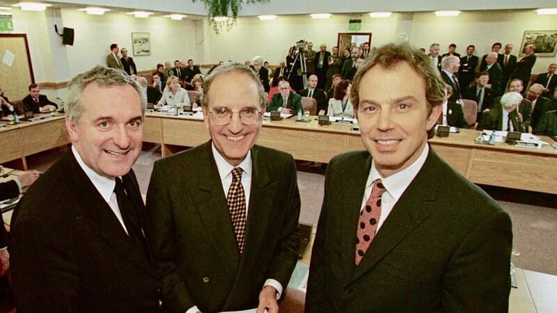 Tony Blair, Senator George Mitchell and Bertie Ahern after they signed the Good Friday Agreement in April 1998. Photo by Dan Chung. 
