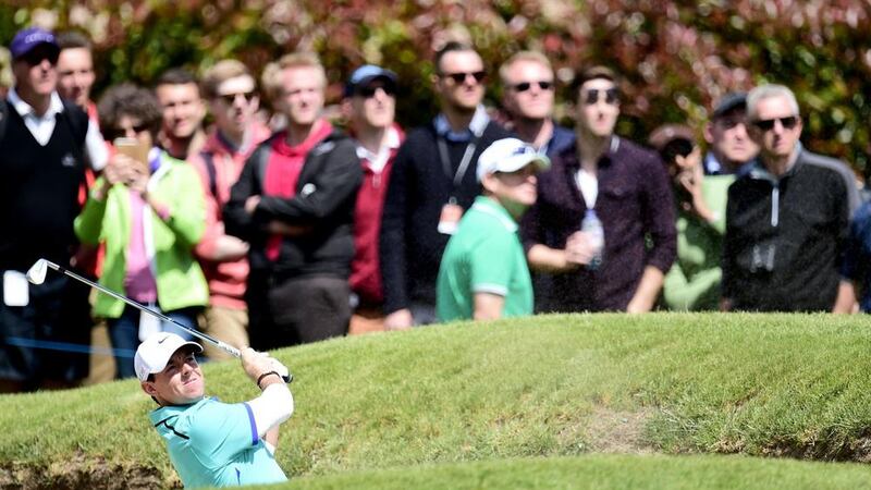 Rory McIlroy plays out of a bunker at the BMW PGA Championship at Wentworth, England on Thursday Picture: PA 
