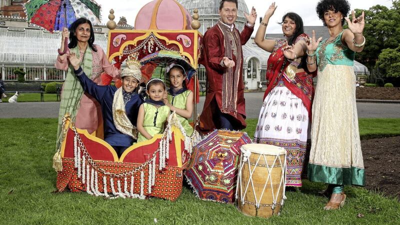This year&#39;s Belfast Mela will be hosted by Carolyn Stewart and Paul Reilly, pictured with ArtsEkta founder Nisha Tandon, Bollywood dancer Dona Das Gupta and Noah (9), Amelia (8) and Aria (4). Picture by William Cherry 