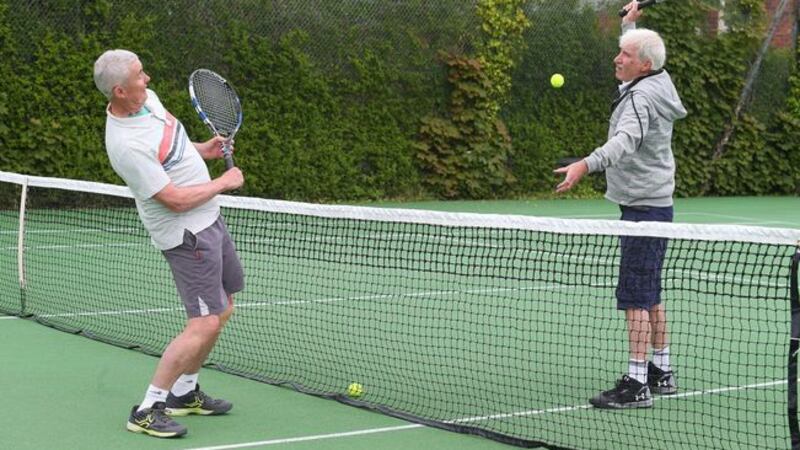 Maurice Roberts and Pearse Linden get back into the swing of things at Cavehill Tennis Club in North Belfast yesterday. Picture by Mal McCann.&nbsp;