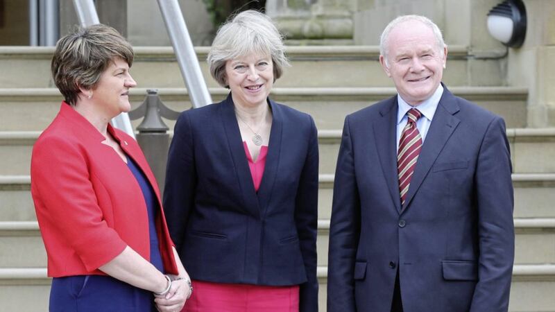 Theresa May (centre) with Arlene Foster and Martin McGuinness in July 2016. Picture by Hugh Russell  