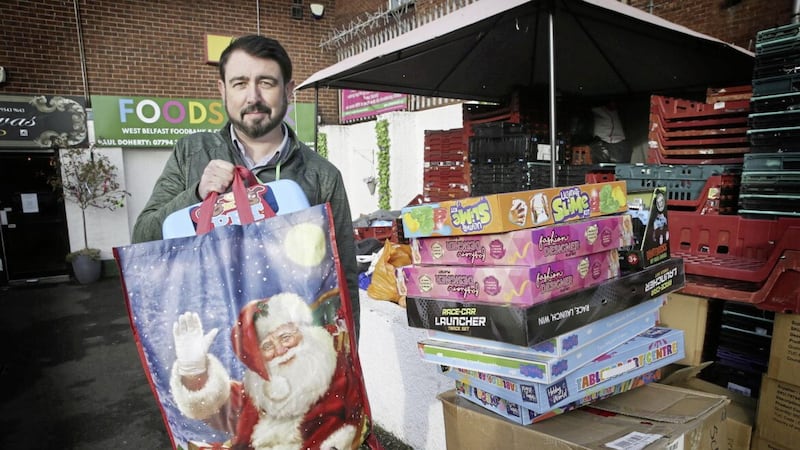 This year many children will be relying on donations for their Christmas gifts. Pictured is Paul Doherty at Foodstock in west Belfast which has been collecting toys. Photo: Hugh Russell. 
