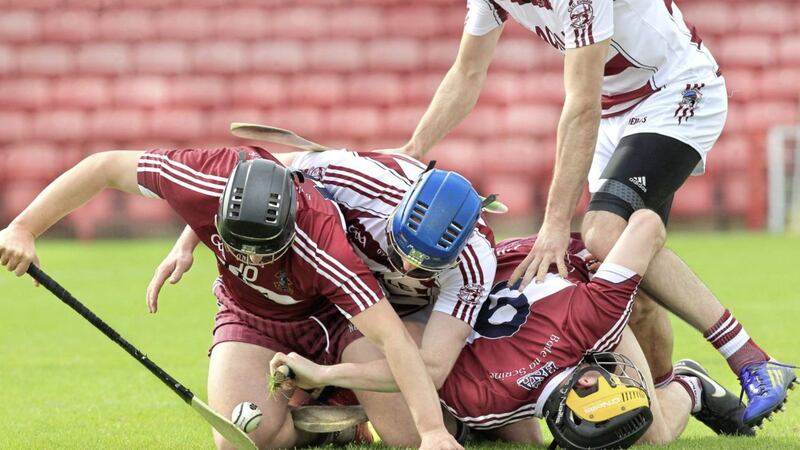 Slaughtneil&#39;s Brian Corbett tangles with Reece McSorley and John McCloskey of Ballinascreen Picture by Margaret McLaughlin 