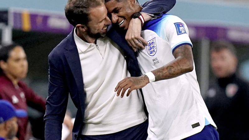 Two-goal Marcus Rashford gets a hug from England manager Gareth Southgate after the World Cup victory over Wales 