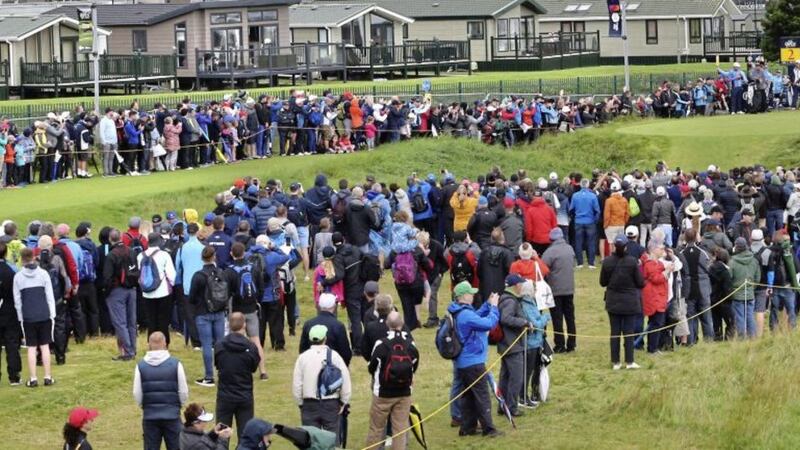 Huge crowds following Rory McIlroy and Justin Thomas around the course despite the rough weather at The Open at Royal Portrush yesterday. Picture by Margaret McLaughlin 