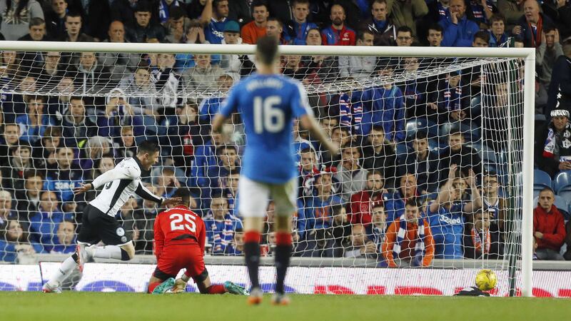 St Johnstone's Michael O'Halloran scores his side's third goal during the third round of the Scottish League Cup at Ibrox on Tuesday night<br />Picture: PA