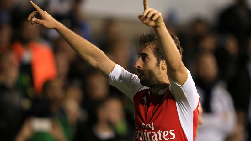 Mathieu Flamini celebrates scoring Arsenal's second goal against Spurs in their midweek Capital One Cup fixture